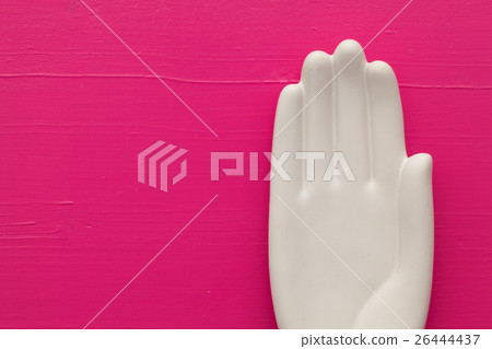 Detail of artifical hand on the wooden table Detail of artifical hand on the wooden table 26444437