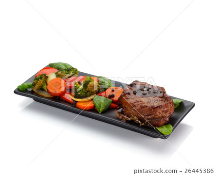Veal steake with vegetables isolated on white  26445386