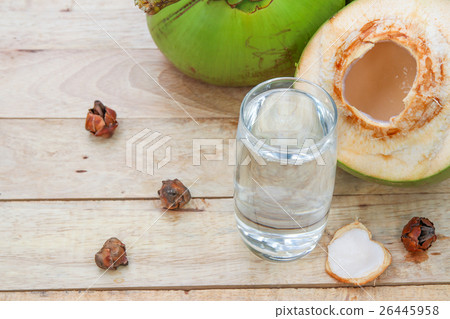 Fresh Coconut Water Drink in glass with coconut le Fresh Coconut Water Drink in glass with coconut le 26445958