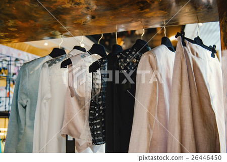 Clothes on racks in a fashion boutique Clothes on racks in a fashion boutique 26446450