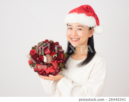 A woman with a Christmas wreath 26448341