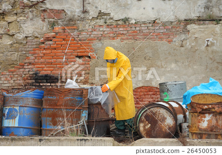 Man with protective  mask explores danger area 26450053