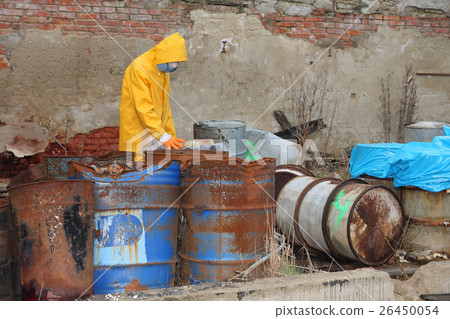 Man with protective  mask  explores danger area  26450054