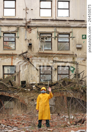 Man with protective mask explores danger area. Man with protective mask explores danger area. 26450075