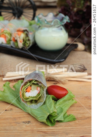 Salad rolls vegetable with tuna and crab stick. 26451617