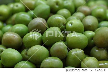 Green whole olives close up background 26452711