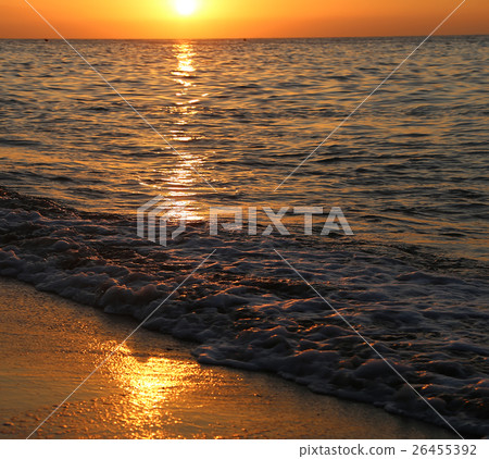 Waves of the sea,illuminated by sunlight at sunset 26455392