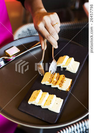 Hand taking butter to the plate Hand taking butter to the plate 26457798