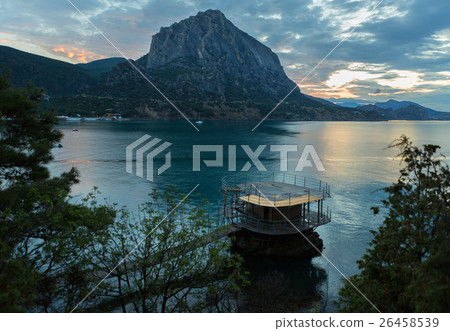 Wooden pier and Mount Falcon near village Novyi 26458539