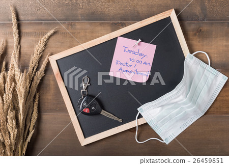 paper note doctor appointment on blackboard  26459851