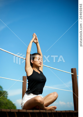 Asian girl doing Yoga at the pier 26469848