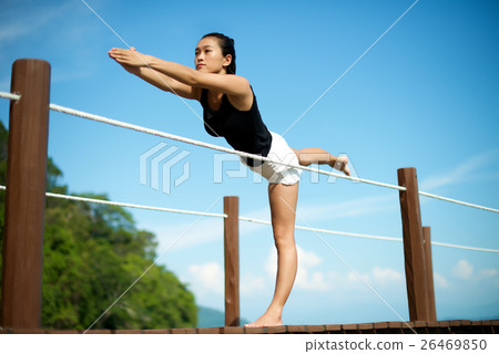 Asian girl doing Yoga at the pier Asian girl doing Yoga at the pier 26469850