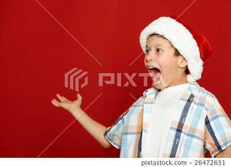 boy child portrait on red, winter holiday concept boy child portrait on red, winter holiday concept 26472631