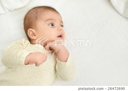 baby portrait lie on white towel in bed baby portrait lie on white towel in bed 26472690