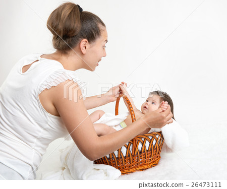 mother talk with baby in basket, family concept mother talk with baby in basket, family concept 26473111