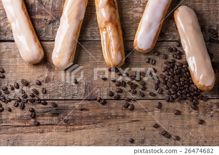Coffee eclairs over wood Coffee eclairs over wood 26474682