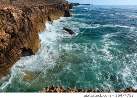 Waves breaking on rocky coast. Waves breaking on rocky coast. 26474792