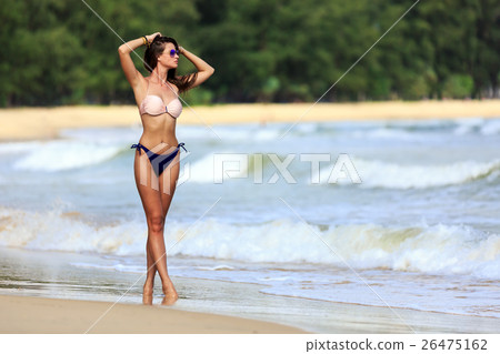 Sexy model posing at tropical beach 26475162