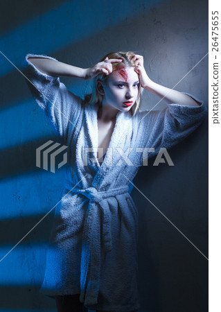 Beautiful woman in bathrobe suffer head trauma 26475655