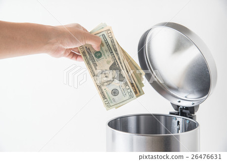 throwing away dollar in trashcan 26476631