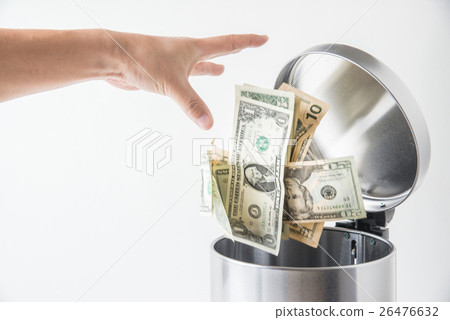 throwing away dollar in trashcan throwing away dollar in trashcan 26476632