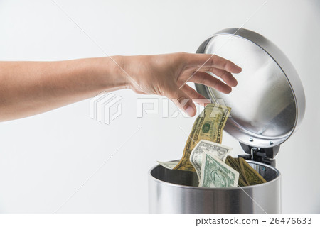 throwing away dollar in trashcan throwing away dollar in trashcan 26476633