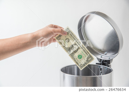 throwing away dollar in trashcan throwing away dollar in trashcan 26476634