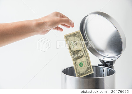 throwing away dollar in trashcan throwing away dollar in trashcan 26476635
