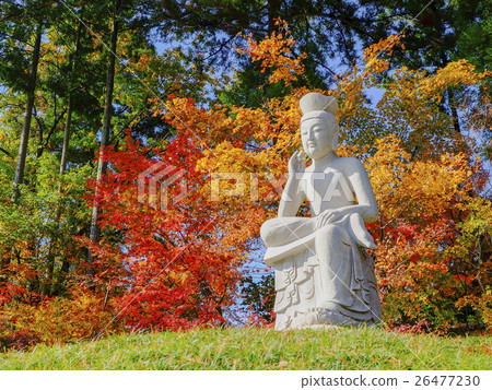Autumn leaves and stone Buddha Autumn leaves and stone Buddha 26477230
