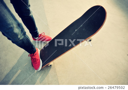young skateboarder legs skateboarding at skatepark young skateboarder legs skateboarding at skatepark 26479502