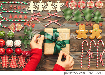 Female hands over christmas gift 26485590