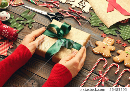 Female hands over christmas gift 26485593