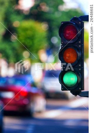 Green traffic light on the street in the summer Green traffic light on the street in the summer 26486681