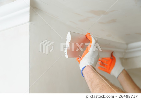 Installation of ceiling moldings. 26488717