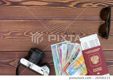 Camera and supplies on office wooden desk table.  26490215