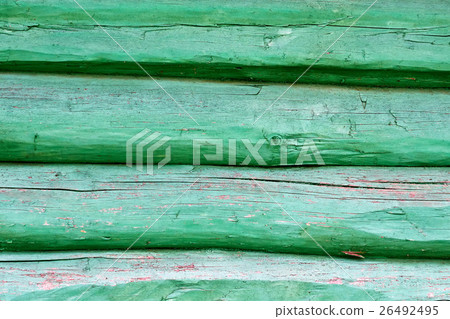 old wall made of wooden logs painted in green col 26492495