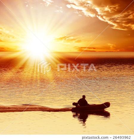 Man on a motor boat 26493962