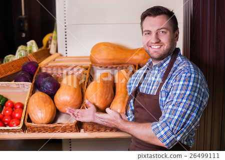 Man offers vegetables. Man offers vegetables. 26499111
