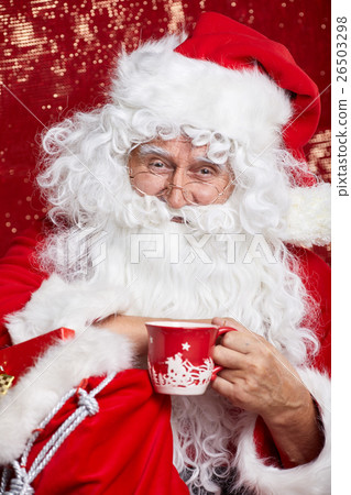 Portrait of Cheerful Santa Claus in Christmas concept  against r 26503298