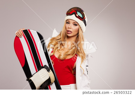 attractive sexy woman standing holding snowboard attractive sexy woman standing holding snowboard 26503322