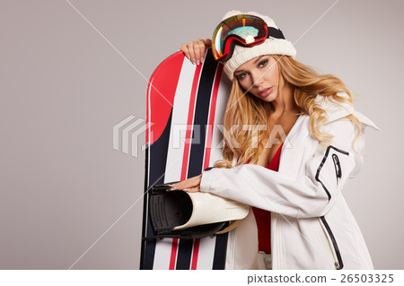 attractive sexy woman standing holding snowboard attractive sexy woman standing holding snowboard 26503325