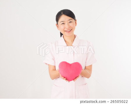 A nurse woman with a pink heart A nurse woman with a pink heart 26505022
