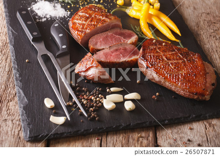 Freshly sliced roast duck breast closeup 26507871