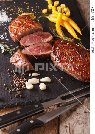 Tasty sliced roast duck breast with herbs 26507873