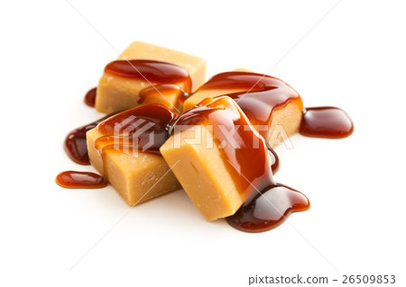 Caramel candies with caramel sauce. Caramel candies with caramel sauce. 26509853