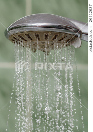 Closeup of shower head with flowing water 26512627