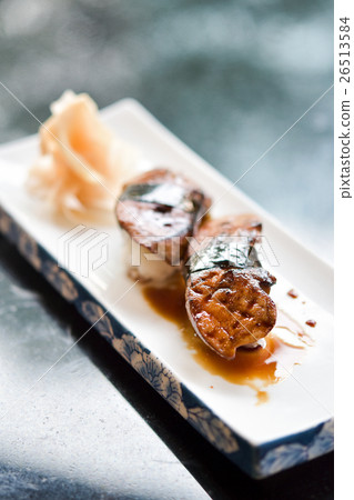 Grilled foie gras sushi on plate 26513584