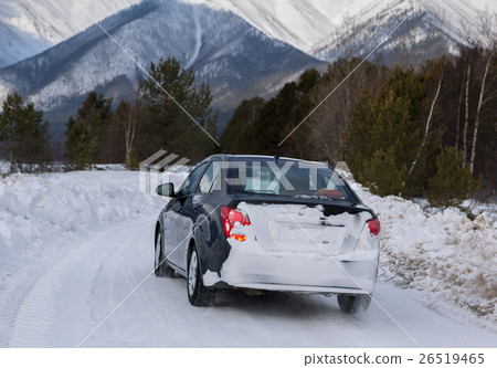 Car goes on the snow-covered road in Trans-Baikal 26519465