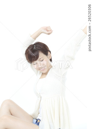 A young lady in a relaxing pose 26520306