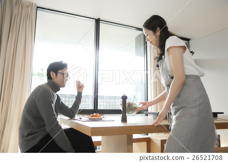 A woman preparing meals 26521708